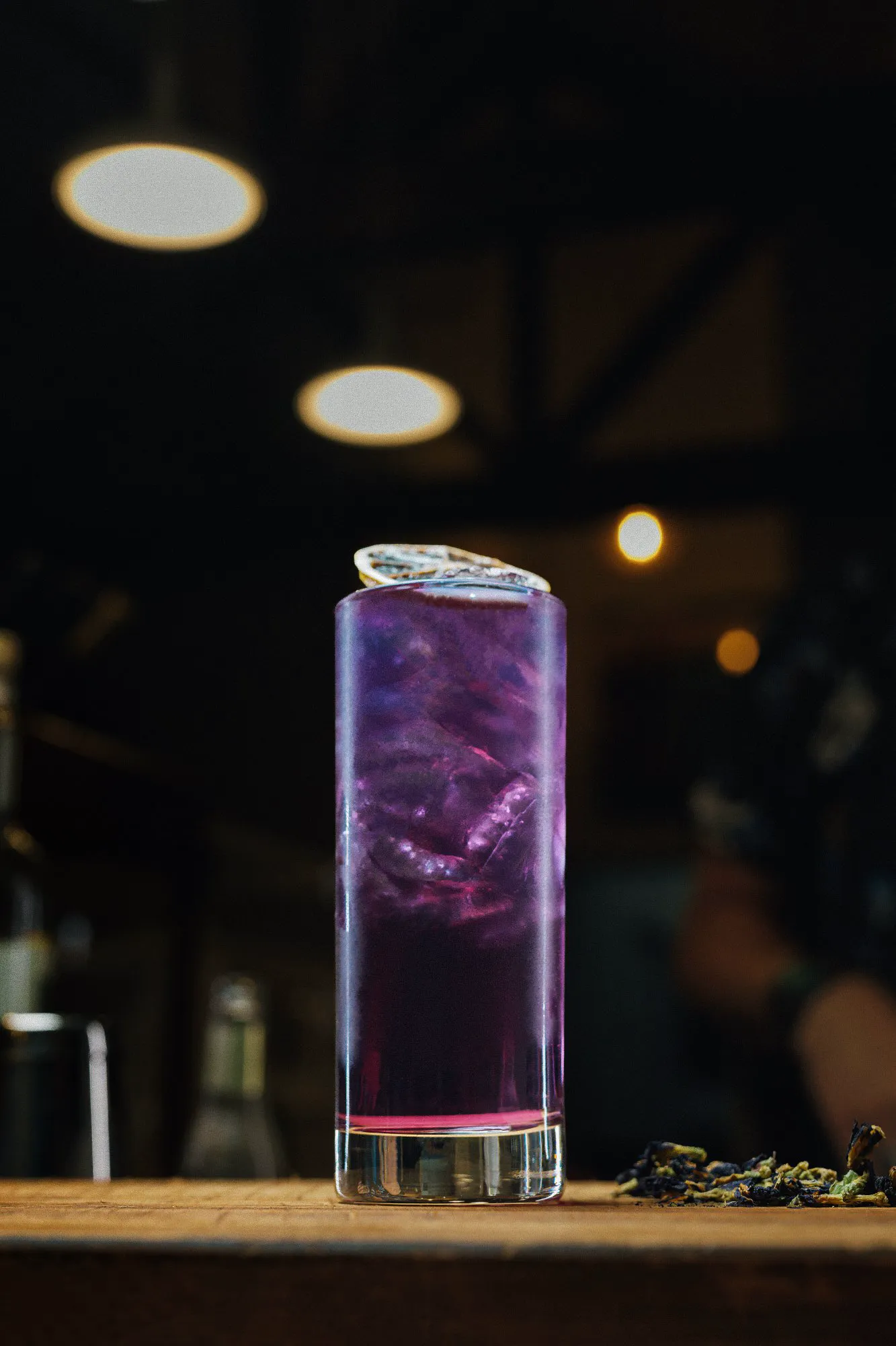 Seasonal craft cocktail with fresh garnish at Adesso